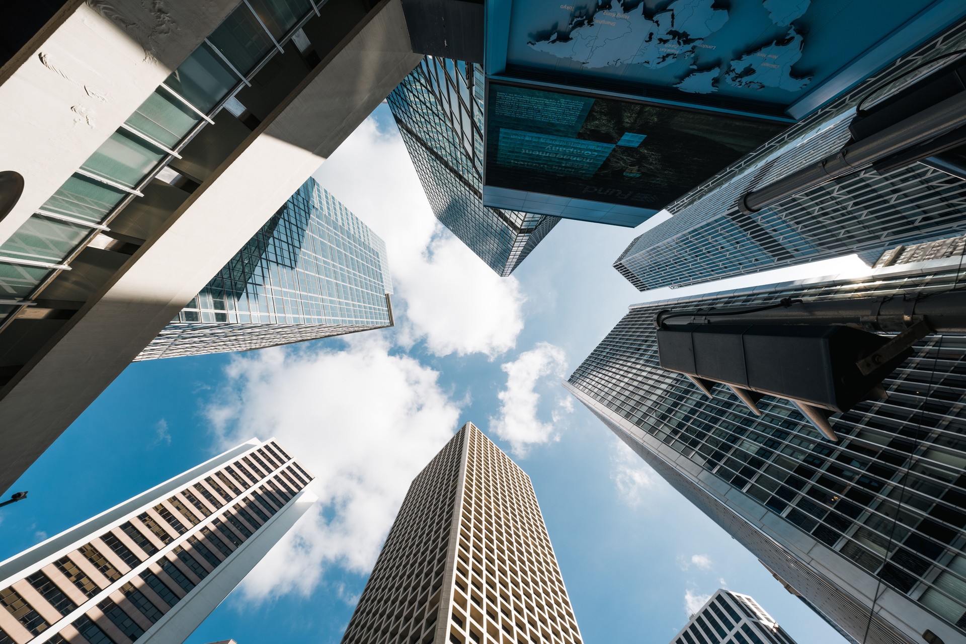 Skyscraper, cloud on sunny sky, corporate business building in Hong Kong central financial district. Low angle view. Enterprise organisation company, Asia economy, office people job work concept